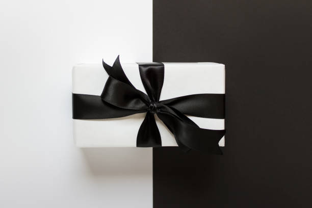 istock Present in black and white color with bow 1186798317