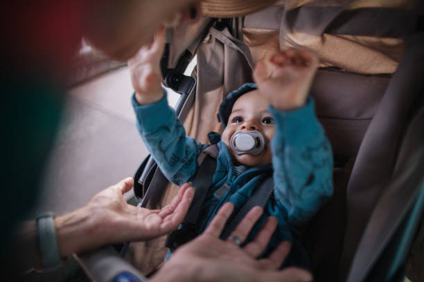 istock Little smiling baby boy reaching his hand 1186798410