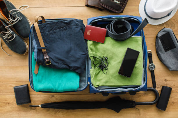istock Packed suitcase with clothes and personal possessions 1186803482