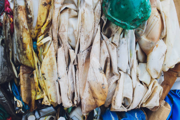 istock Plastic pressed bales at the modern waste hazardous processing plant. Separate garbage collection. Recycling and storage of waste for further disposal. Business for sorting and processing of waste. 1186803568