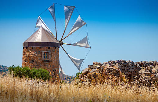 Old windmill in the mountains on the island of Crete, Greece.