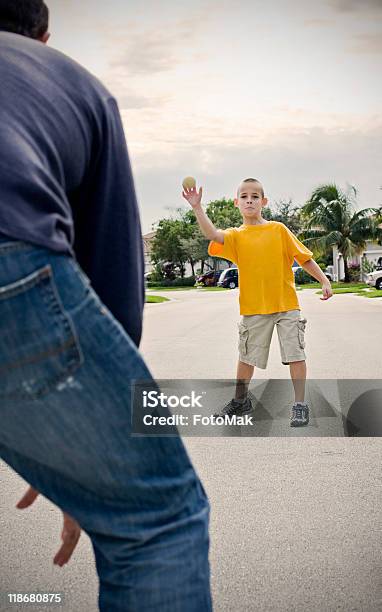 Father And Son Playing Catch Outdoors Stock Photo - Download Image Now - Adult, Blue, Blurred Motion