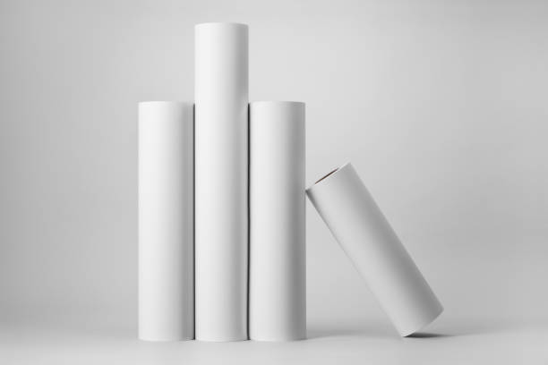 istock Blank white paper rolls mockup isolated on gray background 1186808892