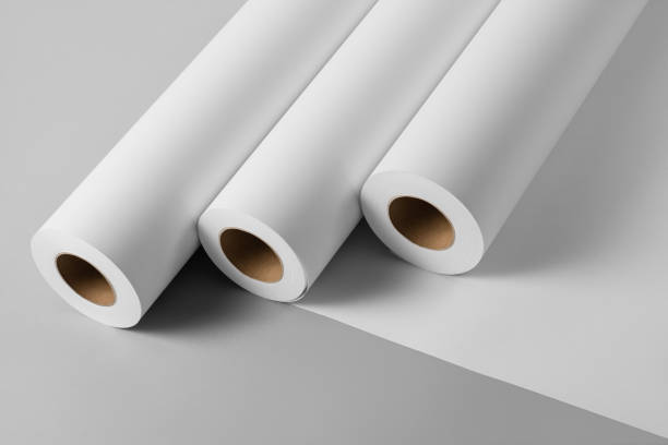 Blank white paper rolls mockup isolated on gray background Blank white paper rolls isolated on gray background. Mockup paper for magazines, catalogs or newspapers isolated on gray backdrop, Printing house theme or wrapping paper for presents rolling photos stock pictures, royalty-free photos & images
