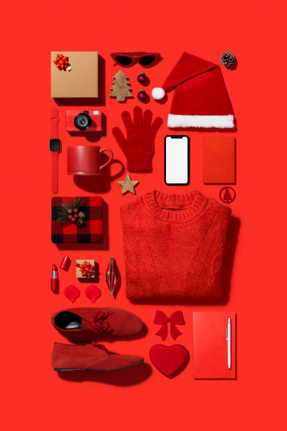 istock Christmas shopping flat lay on red background 1186811760
