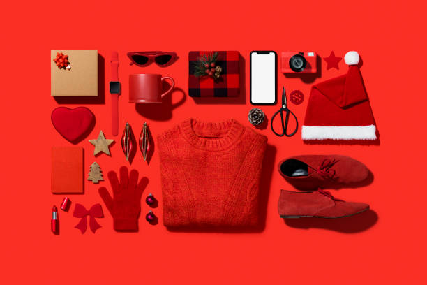 Christmas shopping flat lay on red background