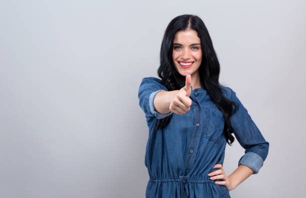 istock Young woman giving thumb up 1186816616