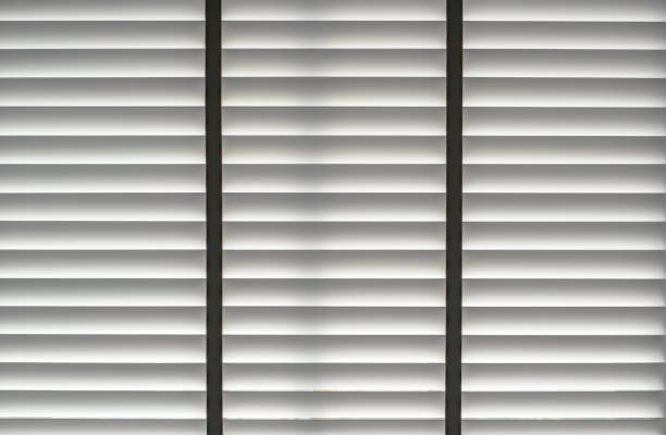 istock window blinds texture background, curtain made by vintage white color wood pattern for UV or sunlight protection in room, creative idea for urban modern home lifestyle decoration design 1186816688
