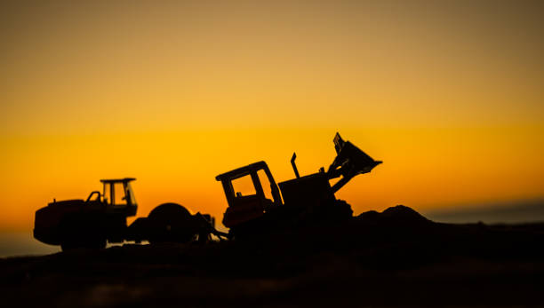 istock Abstract Industrial background with construction crane silhouette over amazing sunset sky. Mobile crane against the evening sky. Industrial skyline. Selective focus 1186826441