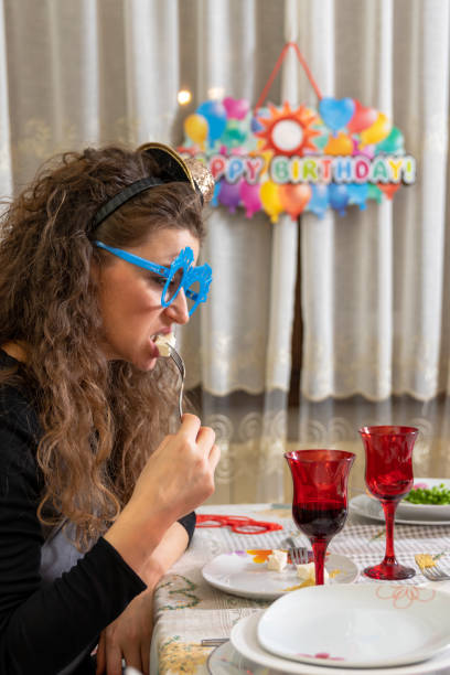 istock woman eating 1186827389