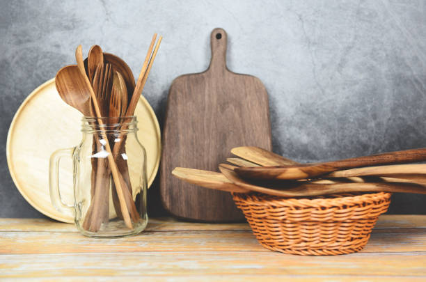 istock Natural kitchen tools wood products / Kitchen utensils background with spoon fork chopsticks plate cutting board object utensil wooden concept 1186833142