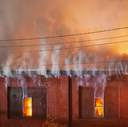 Industrial building fire scene at night. (No injuries)