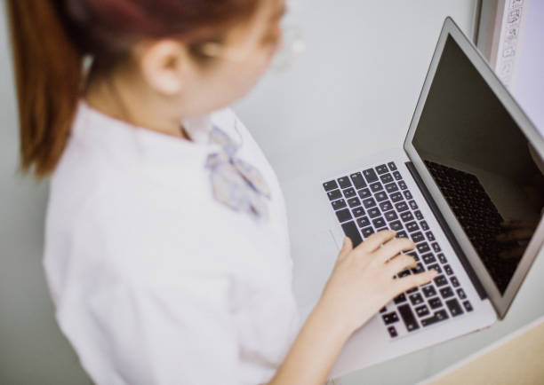 istock Beautiful woman working in office 1186834470