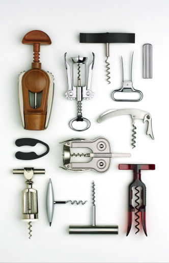 Various wine corkscrews on wooden table. Top view flat lay with copy space for your text