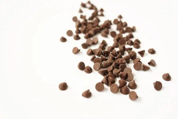 Semi Sweet Chocolate Chips isolated on white background selective focus. copy space