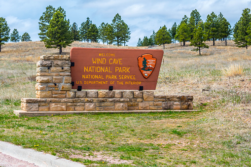 Wind Cave National Park, SD, USA - May 5, 2019: A welcoming signboard at the entry point of preserve park