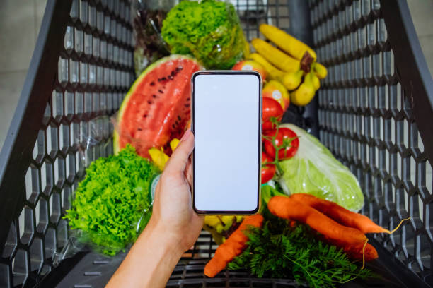 istock phone with empty blank white screen shopping cart on background copy space 1186843063