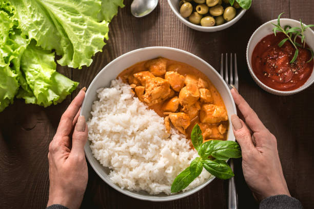 istock Indian curry chicken with basmati rice in bowl 1186843310