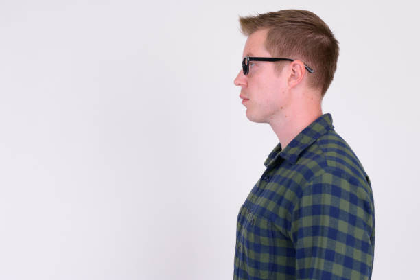istock Profile view of young handsome hipster man against white background 1186845555