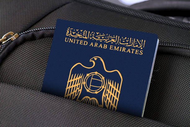 Close up of UAE Passport in Black Suitcase Pocket Photo of a single suitcase made of fabric material and one passport in pocket. united arab emirates photos stock pictures, royalty-free photos & images