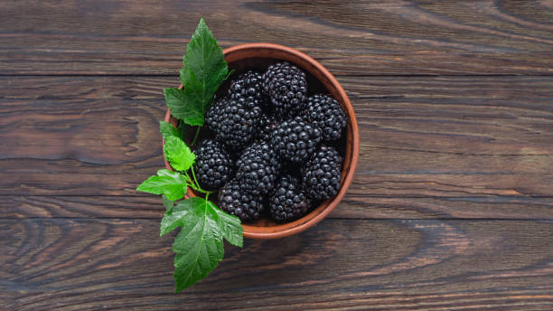 istock ripe raspberries, raspberries strawberries, blueberries blackberries, currants raspberries, wooden background, copy space 1186849486