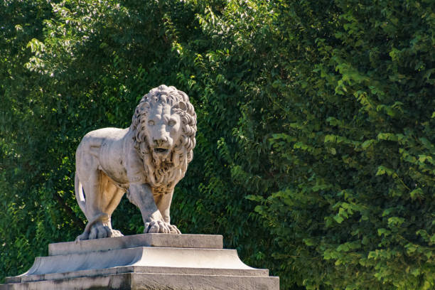 istock Lion sculpture in the park 1186852064