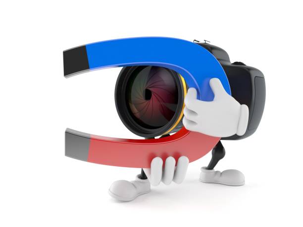 istock Camera character holding horseshoe magnet 1186852180