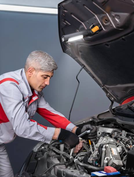istock Auto Mechanic Change the Engine Machine Part in the Car 1186853222