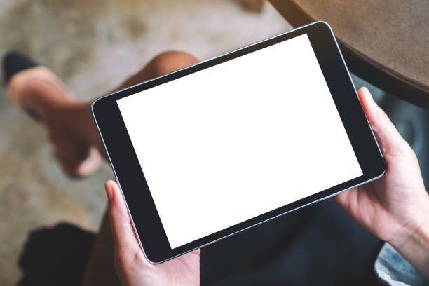 istock a woman holding black tablet with white blank screen 1186858741