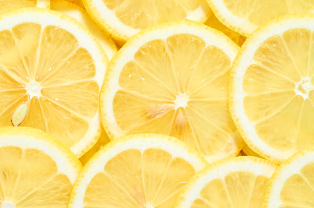istock background of heap fresh yellow lemon slices. pattern for your design 1186859302