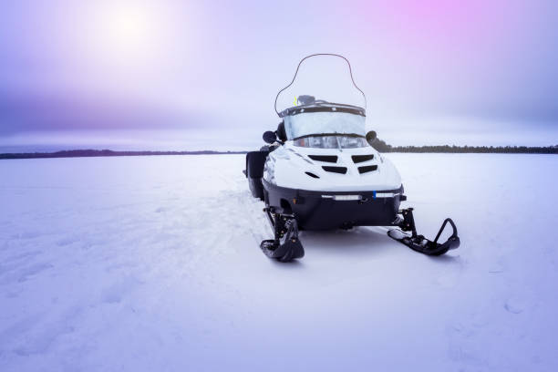istock snowmobile on a winter lake, a place for the text. 1186859917