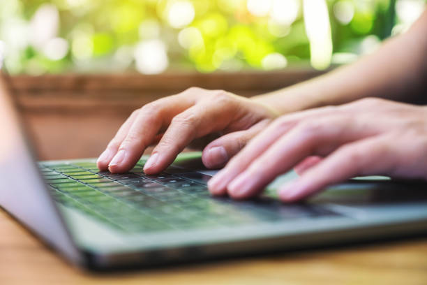 istock a woman working and typing on laptop computer on the table 1186859964