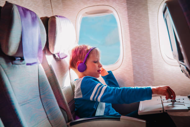 istock little boy with headset play with toy plane in flight 1186864835