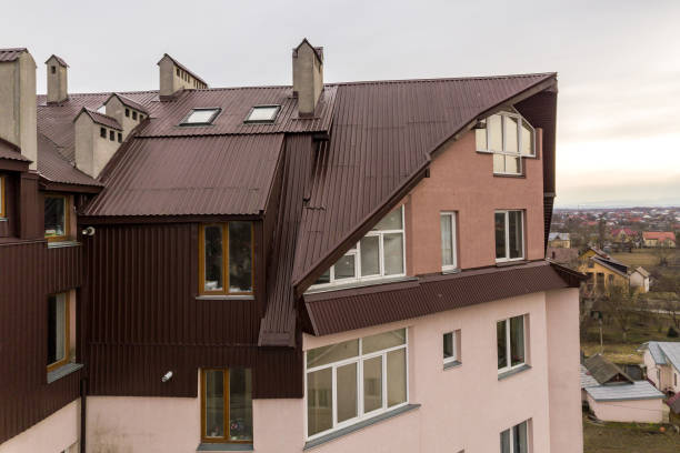 istock High apartment building with many windows and metal sheets roof. 1186865039