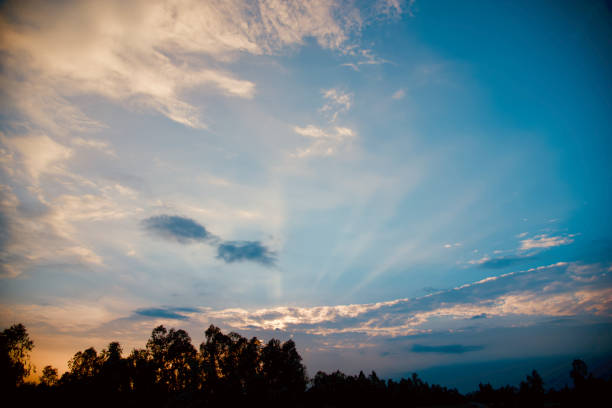 istock Blue and orange cloudy afternoon sky unique photo 1186873880