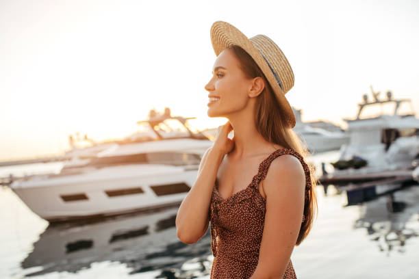 istock Woman walking by the marina 1186874867
