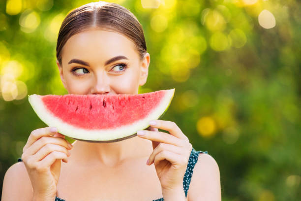 istock Cheerful girl with watermelon 1186874985