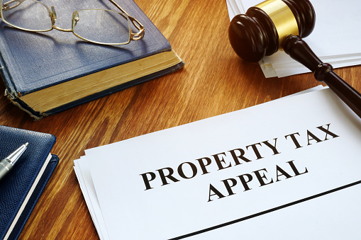 Property Tax Appeal documents and wooden gavel.