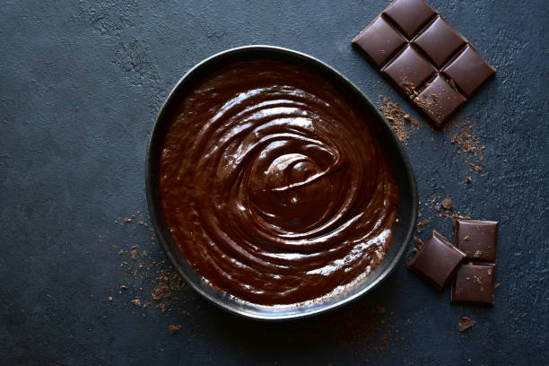 istock Homemade chocolate ganache in a black bowl 1186875282