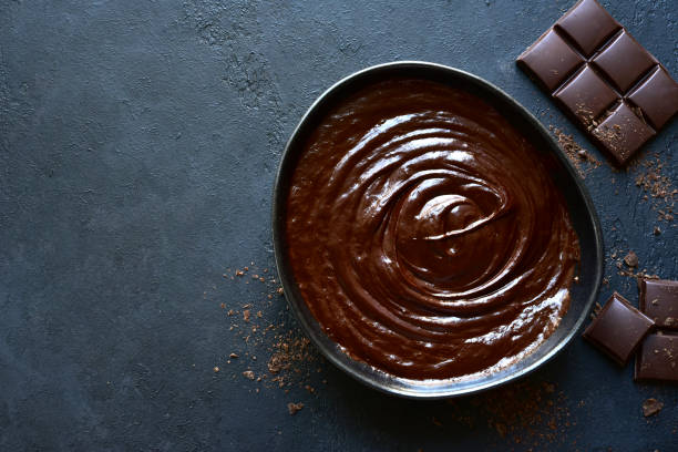 istock Homemade chocolate ganache in a black bowl 1186875324