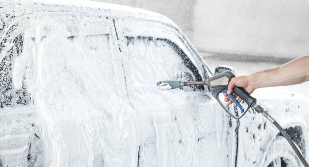istock Car washing. The washing process on a self service car wash 1186875594