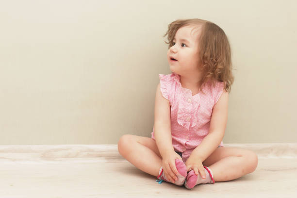 istock Young kid playing on a floor in a room 1186879581