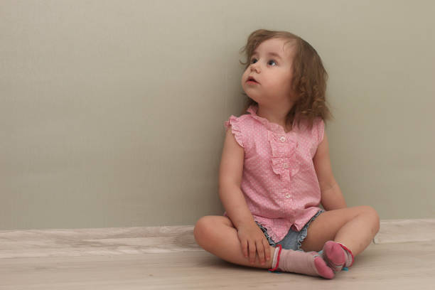 istock Young kid playing on a floor in a room 1186879615