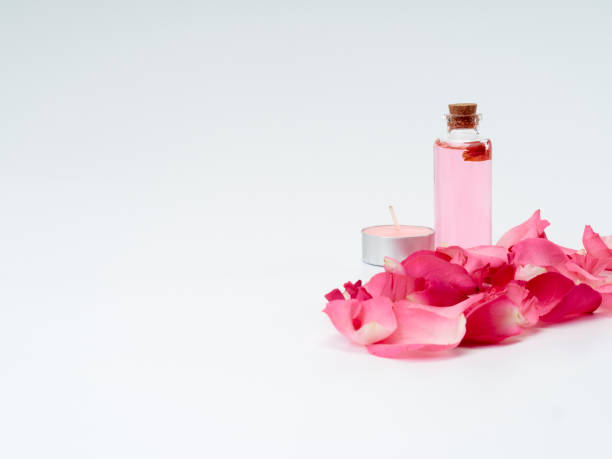 istock Spa set of oil extracted from roses on white table. Space for text 1186880876