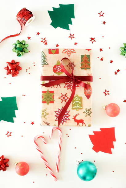 istock Christmas background with gift boxes,  Xmas or new year decorations pattern on white background top view 1186882684