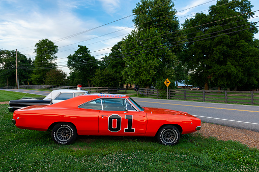 Tennessee, USA - June 26, 2014: Replicas of the General Lee Charger and the Sheriff car, from the television series The Dukes of Hazzard, parked along a country road in the State of Tennessee.