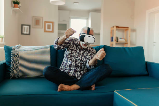istock Senior Man Experiencing Virtual Reality Eyeglasses Headset 1186885253