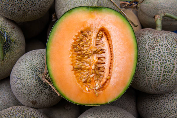 istock Cantaloupe cut half on pile of cantaloupe melon 1186885384