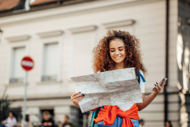 istock Pretty female tourist checking her bearings 1186885474