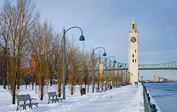 istock winter park by river clock tower snow Montreal 118688630